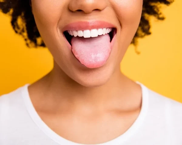 Cosmetic Dentist Gives the Top Benefits of Tongue Scraping